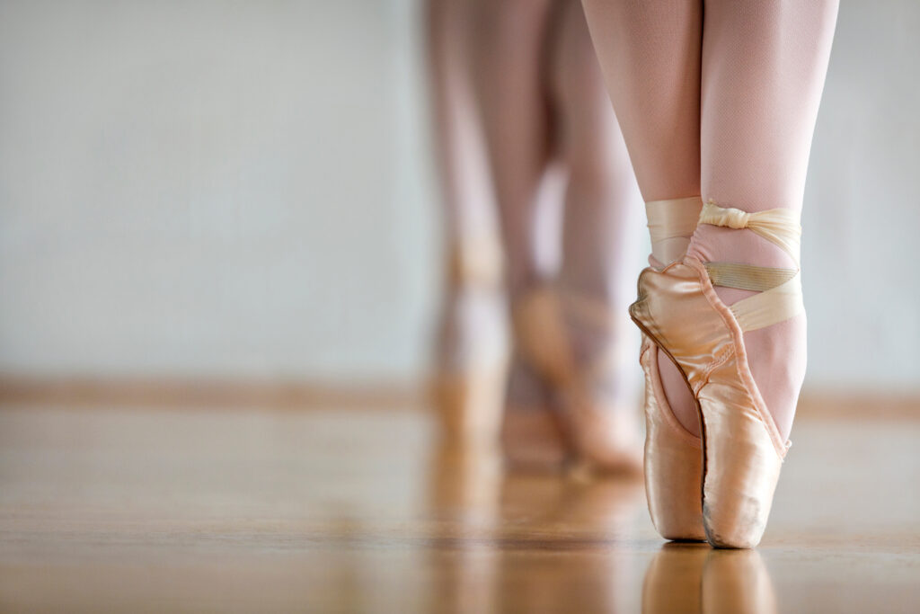 low section of women practicing in ballet studio